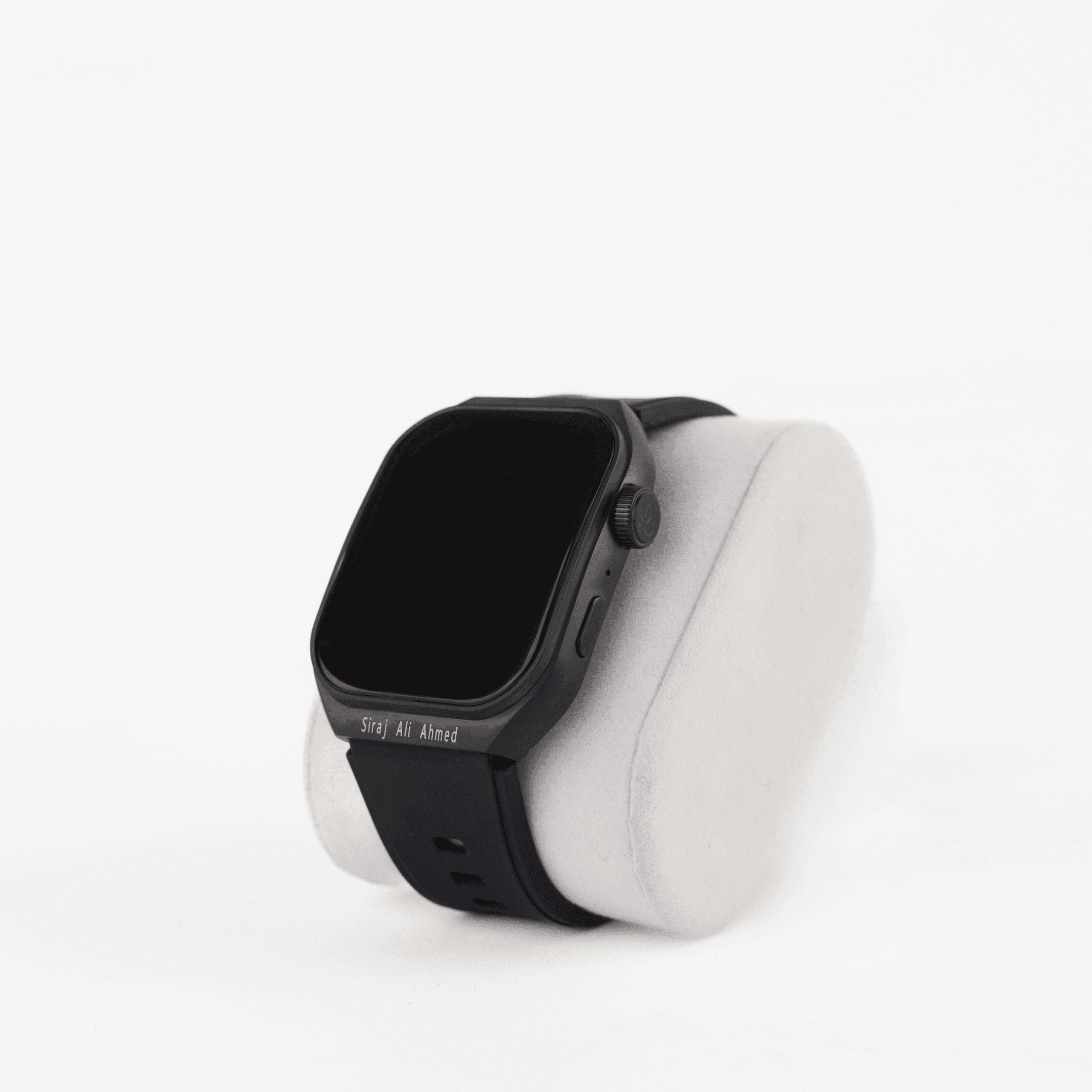 Black M2 Smartwatch displayed on a white cushion
